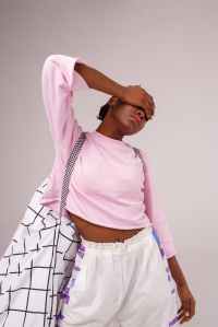 woman wearing pink long sleeved shirt ad white drawstring bottoms